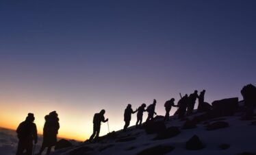 hikers climbing during sunrise 4 Days Mount Kenya climb